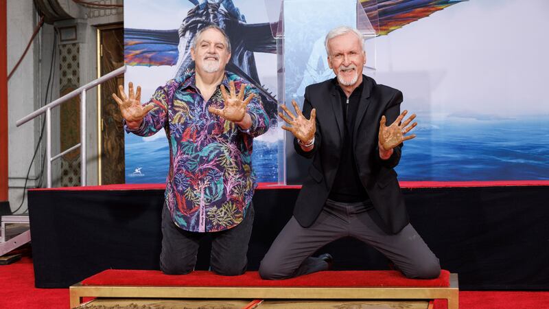 The Oscar-winning pair placed their hands in cement outside the TCL Chinese theatre.
