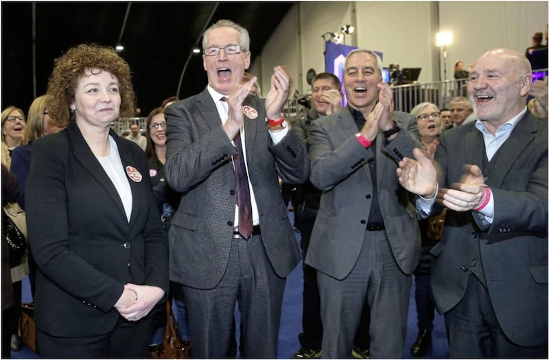 Caral Ni Chuilin and Gerry Kelly celebrate with party members after being elected in North Belfast. picture by Hugh Russell. 