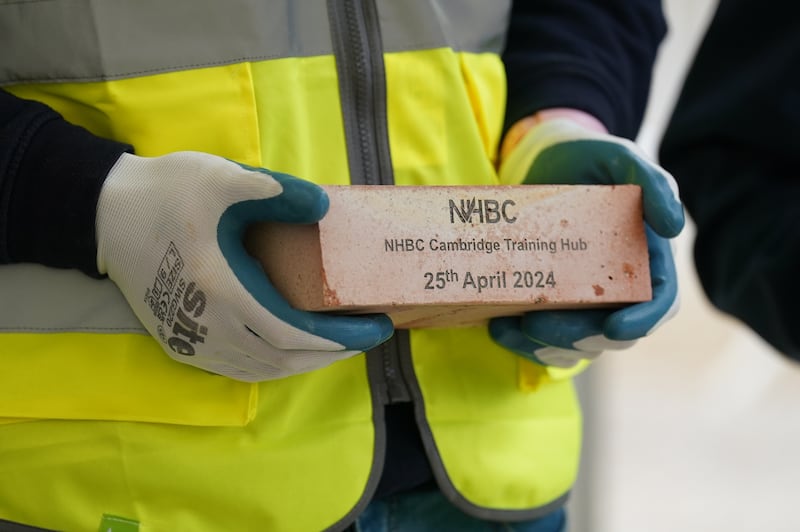 Anne was presented with a commemorative brick after she officially opened the bricklaying training hub