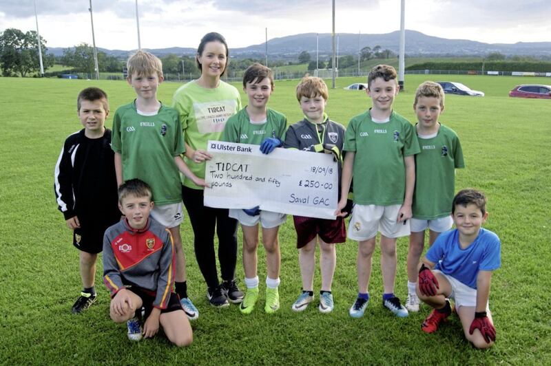 Members of the Saval U10 team present Adele Digney of T1DCAT &ndash; Southern Area (Type 1 Diabetes Children and Teenagers) with a cheque for &pound;250. The proceeds came from last Saturday&#39;s Vincent Dobbin U10 memorial tournament 