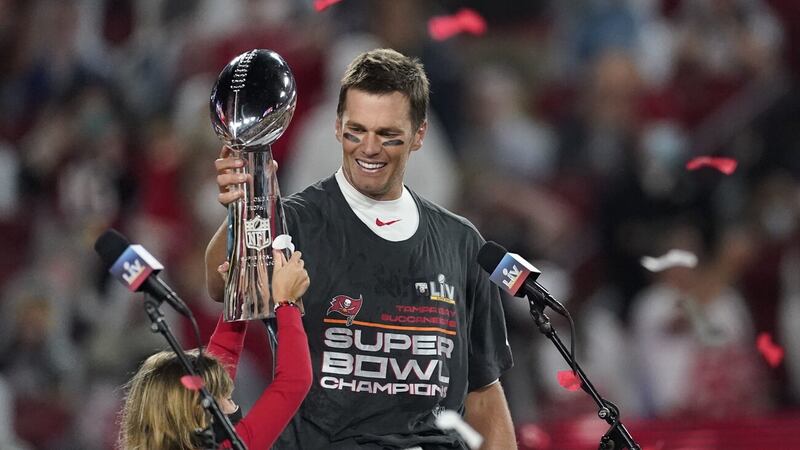 Tampa Bay Buccaneers quarterback Tom Brady holds up the Vince Lombardi trophy after defeating the Kansas City Chiefs in the NFL Super Bowl 55 football game Sunday, Feb. 7, 2021, in Tampa, Florida..