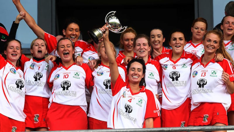 Loughgiel captain Una McNaughton lifts the trophy after the Shamrocks&rsquo; Ulster final win over Slaughtneil