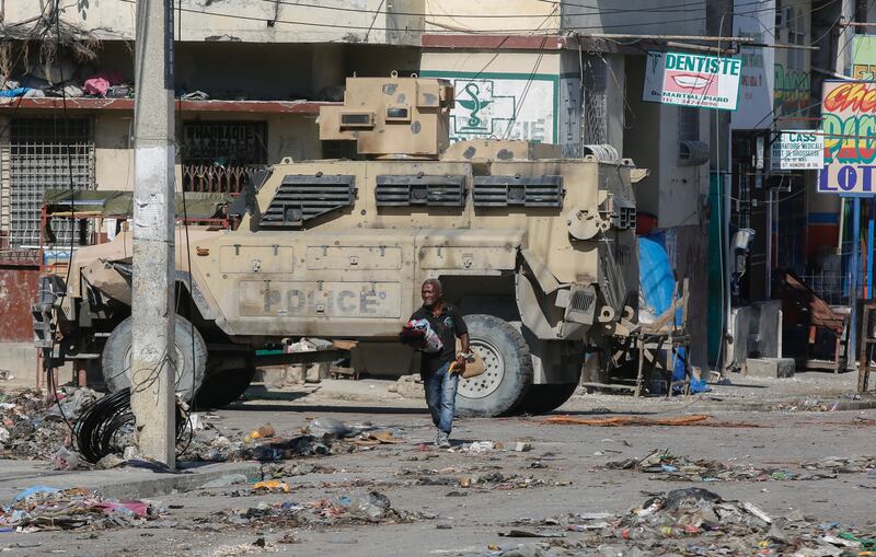 An armoured police vehicle patrols an area in Port-au-Prince, Haiti (Odelyn Joseph/AP)