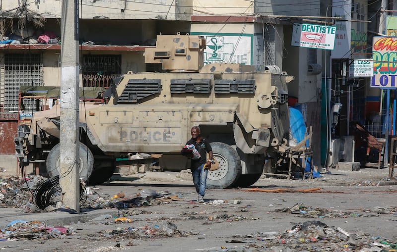 An armoured police vehicle patrols an area in Port-au-Prince, Haiti (Odelyn Joseph/AP)