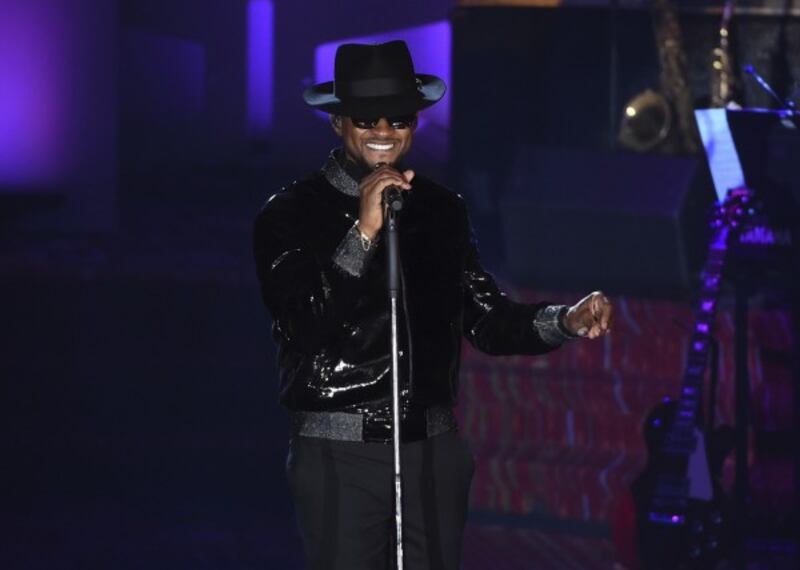 Usher performing at the event
