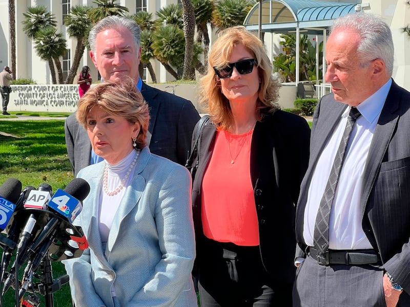 Attorney Gloria Allred speaks as attorney John West, Judy Huth and attorney Nathan Goldberg look on following the verdict in Ms Huth's favour against Bill Cosby on June 21