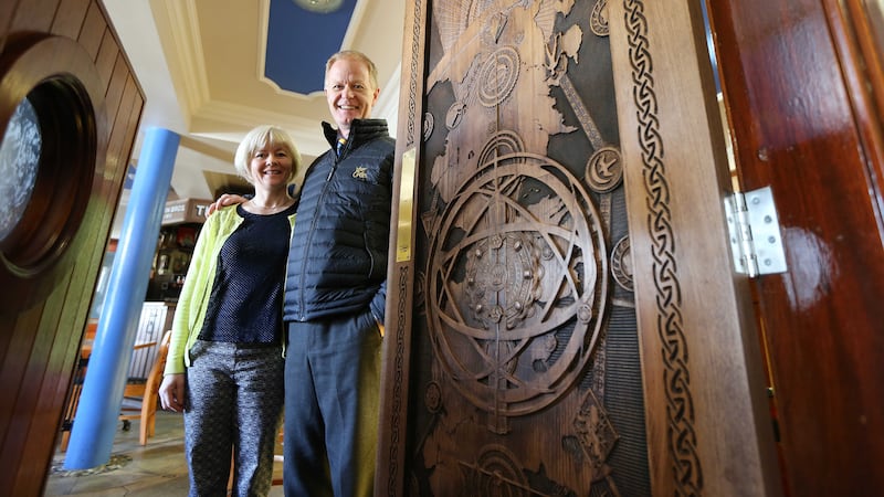 Peter and Caroline McErlean beside the Game of Thrones door at the Cuan Inn&nbsp;