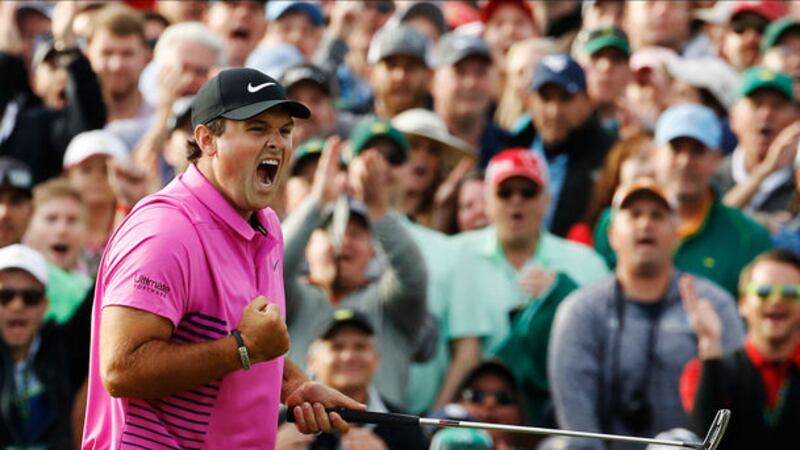 Patrick Reed celebrates after sinking the putt on the a18th to win the Masters at Augusta