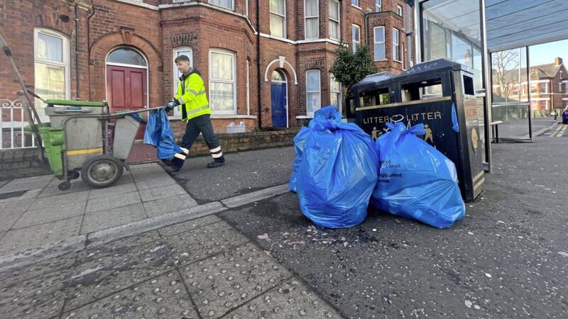 Rubbish is collected in the Holyland area of south Belfast following St Patrick&#39;s Day. Picture by Hugh Russell 
