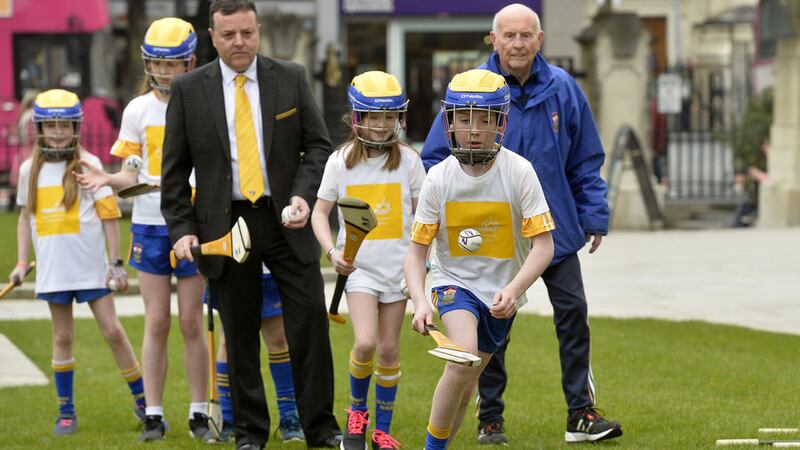 <span style="color: rgb(38, 34, 35); font-family: Arial, Verdana;  font-style: italic; background-color: rgb(244, 244, 244);">A young enthusiast pictured at Friday's Gaelfast launch, which saw the GAA pledge &pound;1m over five years to boost the organisation's presence in Belfast. But the reality that it is likely to go to merely paying six wages underlines how difficult this process will be.</span>