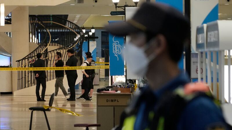 Police officers cordon off the scene near a subway station in Seongnam, South Korea (Ahn Young-joon, PA)