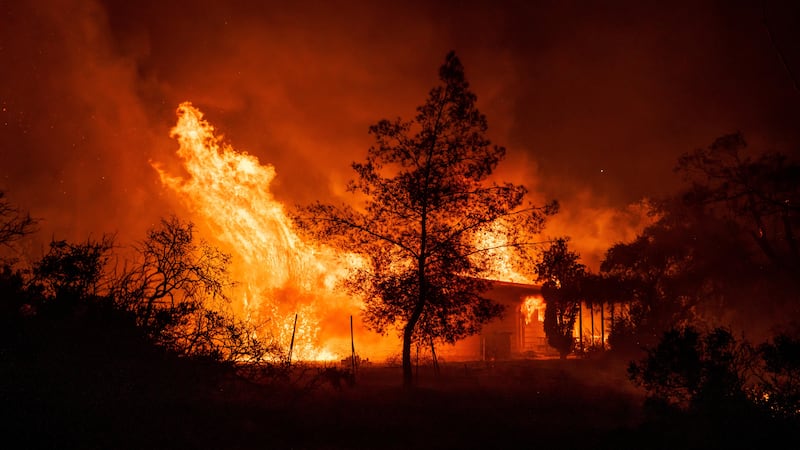 Wildfires are growing larger under the hotter, drier conditions caused by climate change (Ethan Swope/AP)