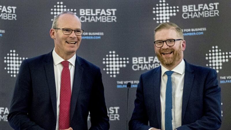 T&aacute;naiste Simon Coveney, left, with Belfast Chamber chief executive Simon Hamilton at the Crown Plaza Hotel during the annual Belfast Chamber of Commerce lunch Picture: Liam McBurney/PA 