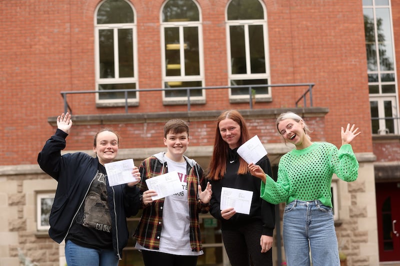 Twins Grace and Jessica Wallace and Kate and Orla Rooney as they collect thier A-Level results from St Dominics in west Belfast. Picture Mal McCann