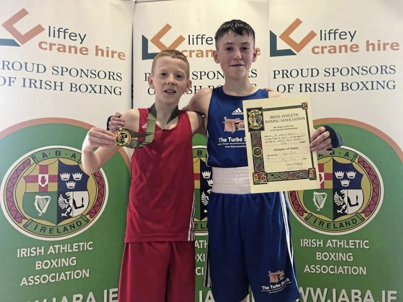 Holy Trinity pair James Kelly (left) and Kyle Smith both returned to Belfast with victory certificates after claiming Irish titles at Dublin&#39;s National Stadium over the weekend 