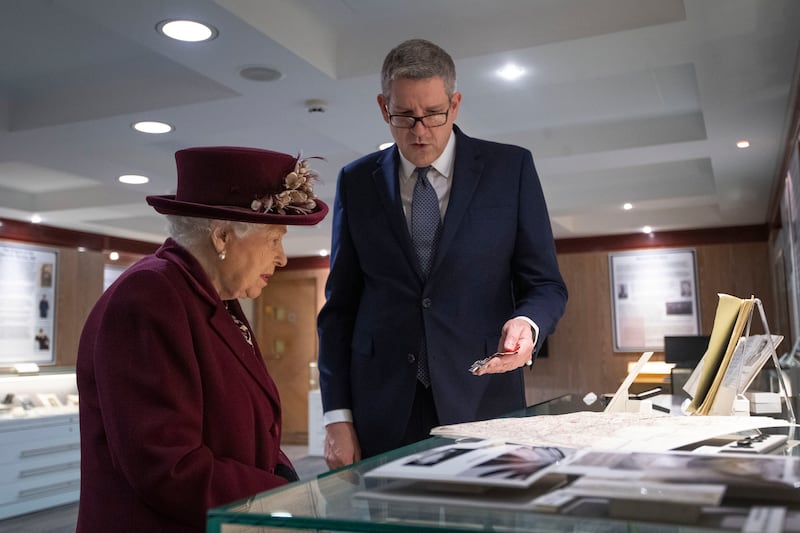 The late Queen looks at artefacts relating to MI5 D-Day operations with then-director general Andrew Parker