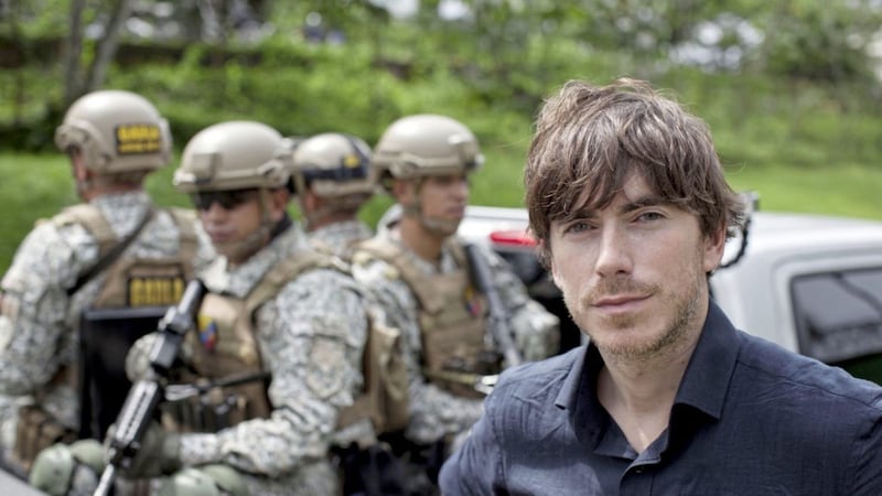 Simon Reeve with the Colombian army in the city of Buenaventura. (C) BBC - Photographer: Jonathan Young 