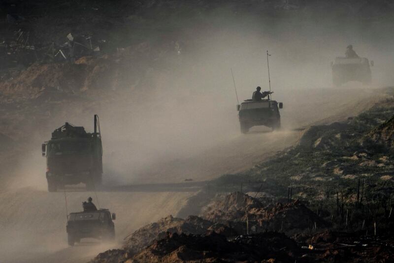 A convoy of Israeli troops moves in the Gaza Strip (Ariel Schalit/AP)