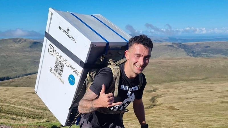 Sam Hammond is trying to break the record for the fastest marathon carrying a household appliance (white goods).