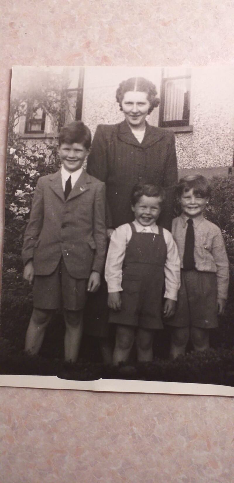 Adrian with his mother and brothers John and Derek in 1948