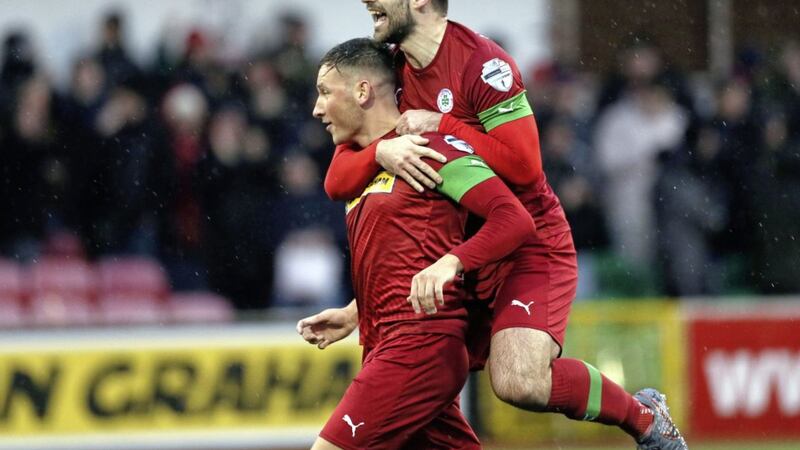 Conor McDermott, seen celebrating after scoring a wondergoal in Cliftonville&#39;s win over Warrenpoint earlier this month, has become a popular in his short term at Solitude. Picture by Pacemaker 