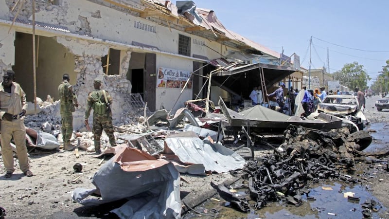 Somali security forces attend the scene of a car bomb attack on a restaurant in Mogadishu, Somalia on Wednesday PICTURE: Farah Abdi Warsameh/AP 