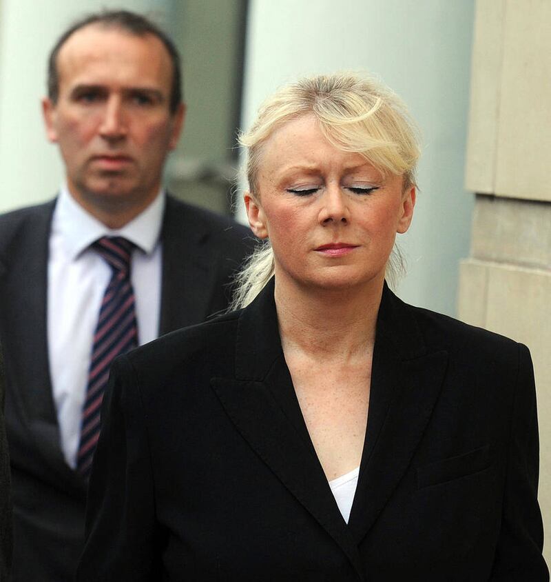 Karen Walsh followed by her husband Richard Durkan arriving at Laganside Courts in Belfast during her 2011 murder trial