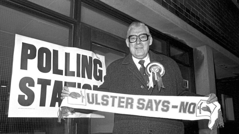 DUP leader Ian Paisley at a polling station in 1986 holding an Ulster Says No banner in protest at the Angle Irish Agreement. Photo: Pacemaker 