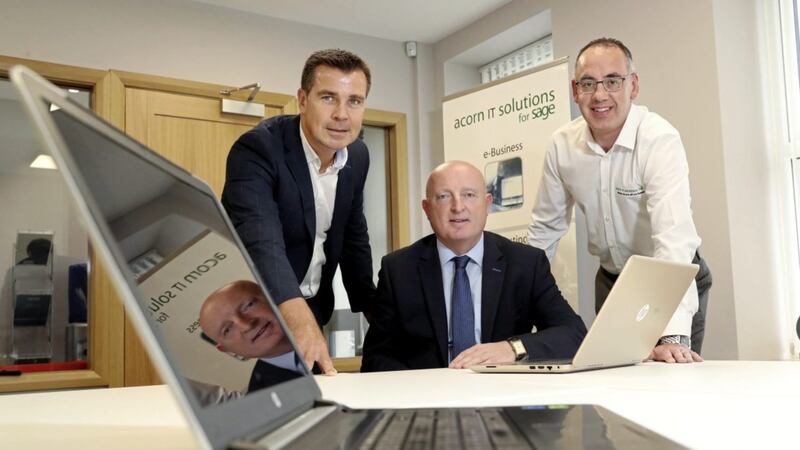 Pictured at the new company premises in Kilrea are Acorn IT co-directors, Declan Bradley (left) and Dominic McMullan (right). Also pictured is Martin Convery, business development manager with Ulster Bank 