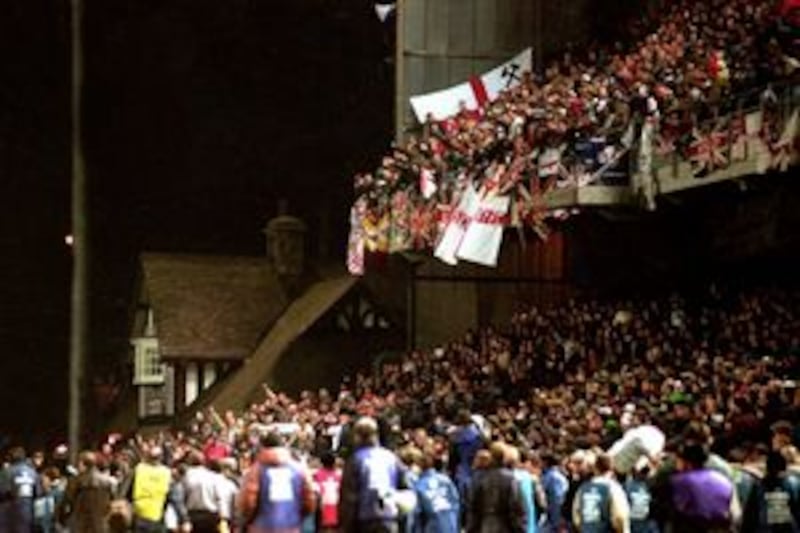 England fans pictured before a riot breaks out at a friendly game with the Republic of Ireland at the Lansdowne Road stadium in Dublin on February 15 1995. With the Republic leading 1-0, rioting England fans forced the match to be abandoned after just 27 minutes.&nbsp;