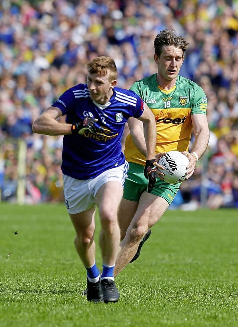 Cavan&#39;s Jason McLoughlin tussles with Donegal&#39;s Hugh McFadden during yesterday&#39;s Ulster Championship clash. Picture by Philip Walsh 