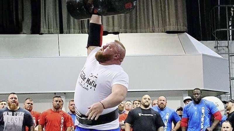 West Belfast strongman Michael Downey presses a British recording-breaking 127.5 kilos above his head with one arm