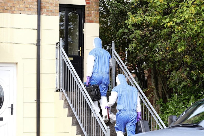 Police and forensic officers at Larkspur Rise in west Belfast. Picture by Mal McCann