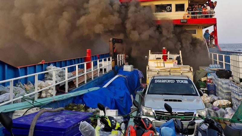 Smoke rises from a ferry in Surat Thani province, Thailand (Maitree Promjampa via AP)