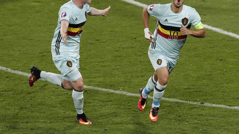 &nbsp;Eden Hazard, right, celebrates with Kevin De Bryune after scoring Belgium's third goal<br />Picture by PA