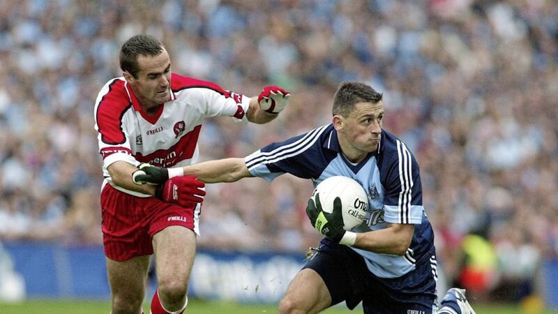 Derry&#39;s Sean Marty Lockhart gets to grips with Dublin&#39;s Alan Brogan at Croke Park. Picture by Sean Loughran 