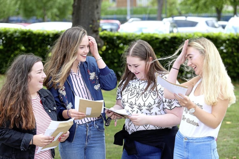 St Dominics pupils celebrate their A Level results Claire Colton, Emily Scott, Melissa Mullen and Caoimhe NicArdail all off to Queens University. Picture by Mal McCann 