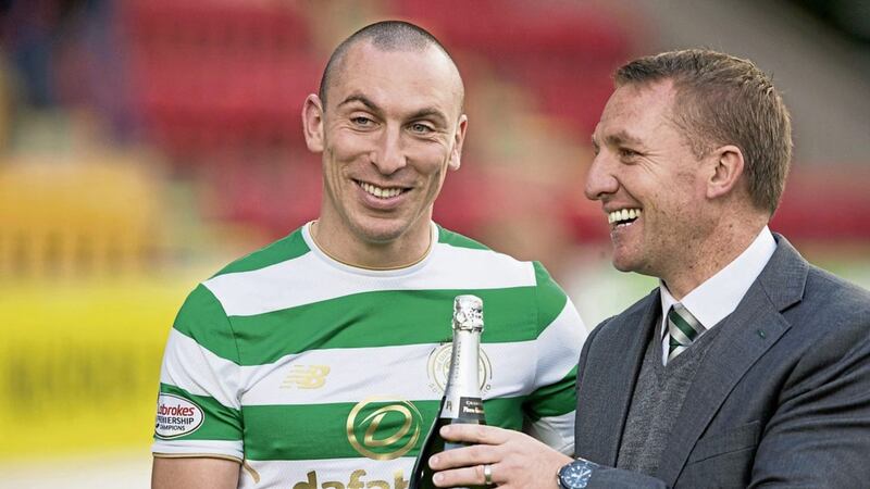 Celtic&#39;s Scott Brown and manager Brendan Rodgers celebrate breaking the record for the longest unbeaten run in domestic competition by a British top-flight team after the Ladbrokes Scottish Premiership match at McDiarmid Park, Perth 