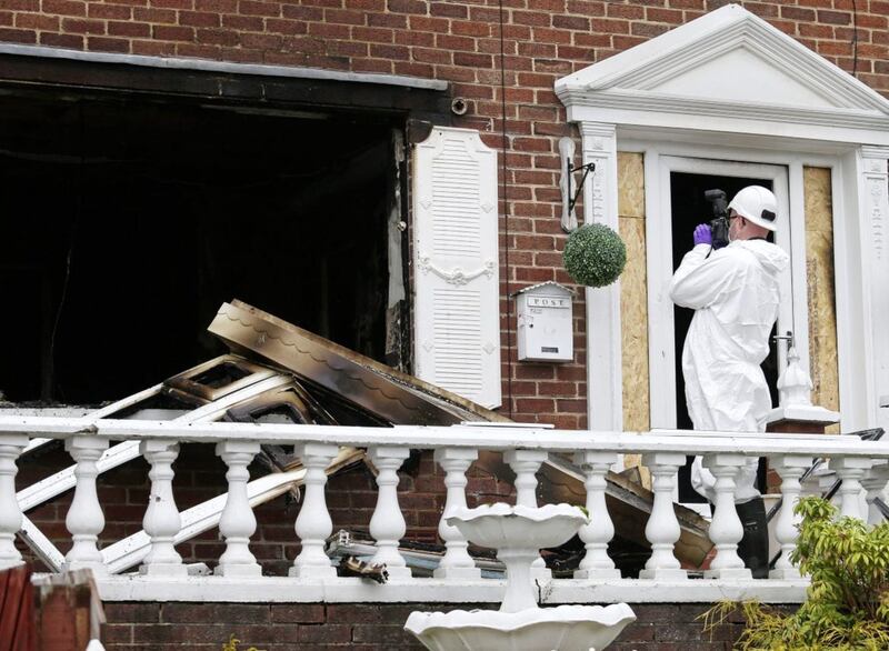 A forensic officer at the scene of an arson attack on the Richmond home in Dermott Hill Parade in west Belfast. Picture by Mal McCann.