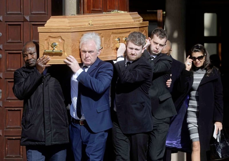 The funeral of Barney Eastwood takes place at St Colmcille's, Holywood, Co Down. Pictured front are Danny Juma and Barneys son Peter. Picture Mark Marlow.