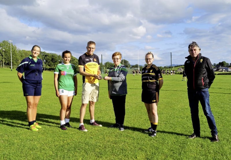History was made in Saval on Saturday when visitors East Belfast made their debut in ladies&rsquo; football. To mark the occasion club president Ann Monaghan presented East Belfast manager Jerome Quinn with a commemorative plaque. Looking on are referee Grainne Sands, Saval captain Eimear Fallon, East Belfast captain Kate Crozier and Down ladies&rsquo; chairman Stephen Magorrian  