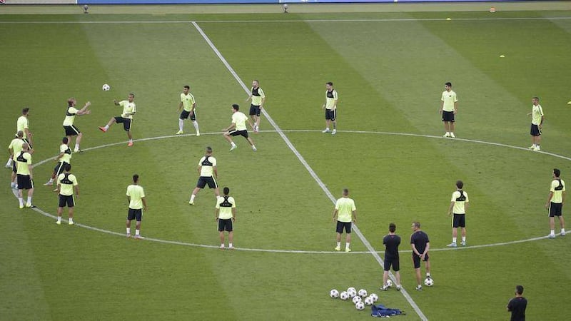 Barcelona&#39;s players are put through their paces at the Olympic stadium in Berlin on Friday night on the eve of their Champions League final against Juventus Picture: AP 