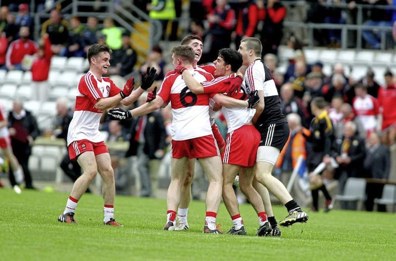 The Derry players celebrate a crucial victory
