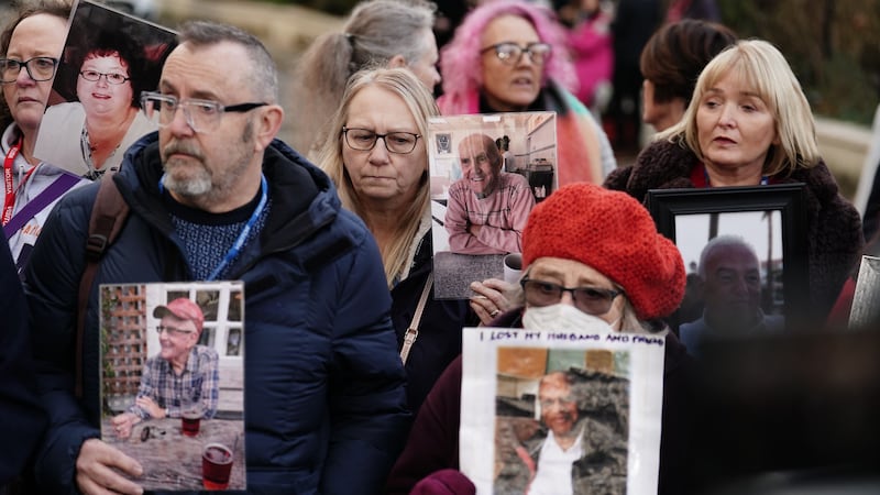 Members of Covid Bereaved Families, holding photographs of their relatives who died during the pandemic, outside Dorland House in London, where Prime Minister Rishi Sunak was giving evidence to the UK Covid-19 Inquiry (Jordan Pettitt/PA)