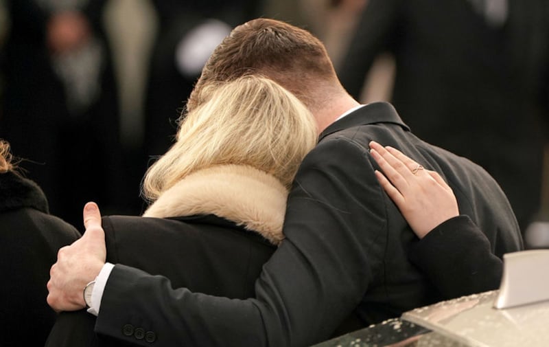 Ashling Murphy's boyfriend Ryan Casey and sister Amy Murphy comfort each other as they arrive for her funeral at St Brigid's Church, Mountbolus, Co Offaly. Picture by Niall Carson/PA Wire&nbsp;