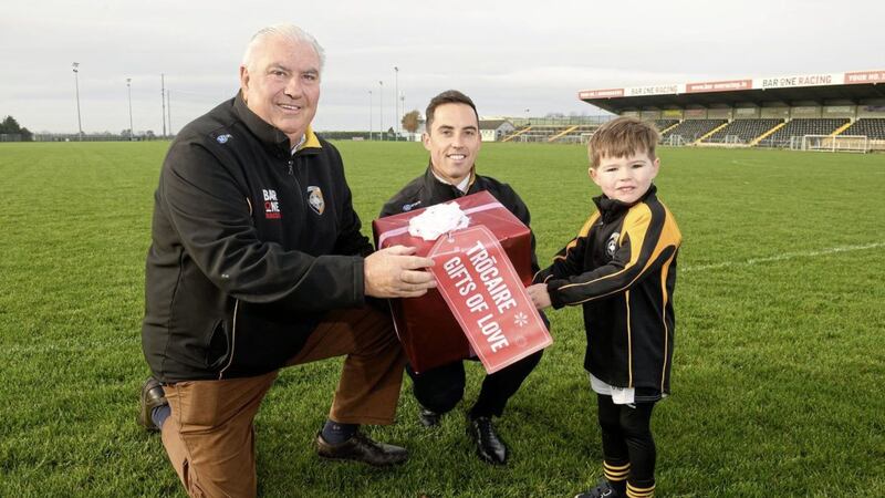 Calling on people to support this year&rsquo;s Chirtsmas Gifts campaign, Armagh&rsquo;s 2002 All-Ireland winning manager Joe Kernan was joined by his son, former Young Footballer of the Year Aaron, and grandson James (4) at their native Crossmaglen GAA club 