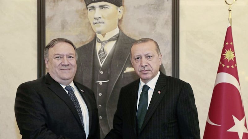 US secretary of state Mike Pompeo and Turkish president Recep Tayyip Erdogan shake hands before a meeting at Esenboga Airport in Ankara, Turkey. Picture by Presidential Press Service via AP, Pool 