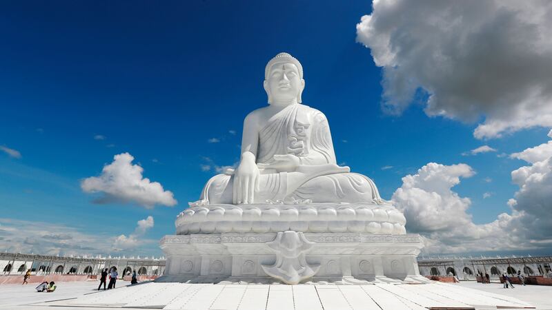 Visitors stand below the sitting Maravijaya Buddha marble statue in Naypyitaw, Myanmar. The Maravijaya Buddha statue is said to be the world’s highest sitting marble Buddha image according to local media (Aung Shine Oo/AP/PA)