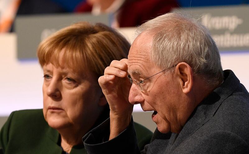 German chancellor Angela Merkel and German finance minister Wolfgang Schaeuble at the general party conference of the Christian Democratic Union in 2016 (Martin Meissner/AP)