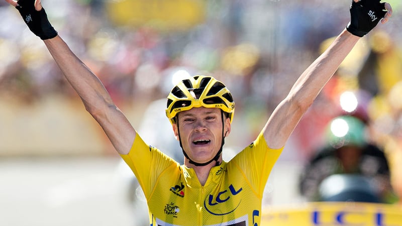 Britain's Christopher Froome, wearing the overall leader's yellow jersey, celebrates as he crosses the finish line to win the tenth stage of the Tour de France cycling race over 167 kilometers (103.8 miles) with start in Tarbes and finish in La Pierre-Saint-Martin, France, Tuesday, July 14, 2015